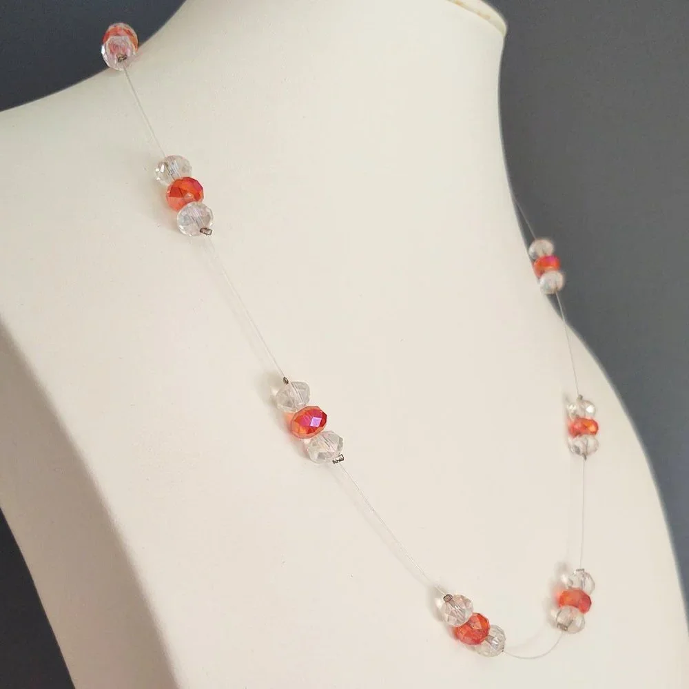 Floating clear and orange crystal necklace